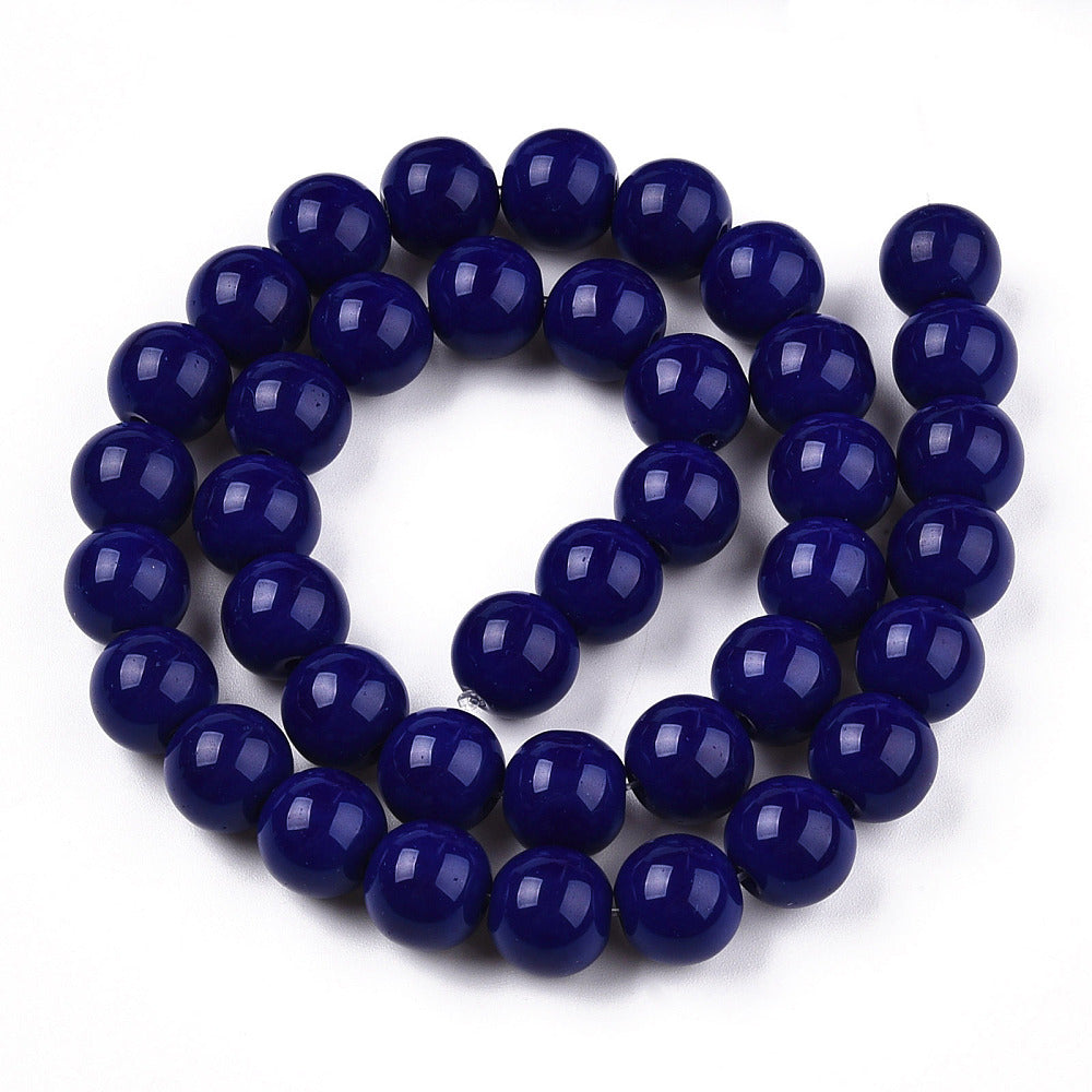 Navy blue beads on a white background