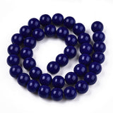 Navy blue beads on a white background