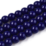 Close-up of dark blue beads on a white background