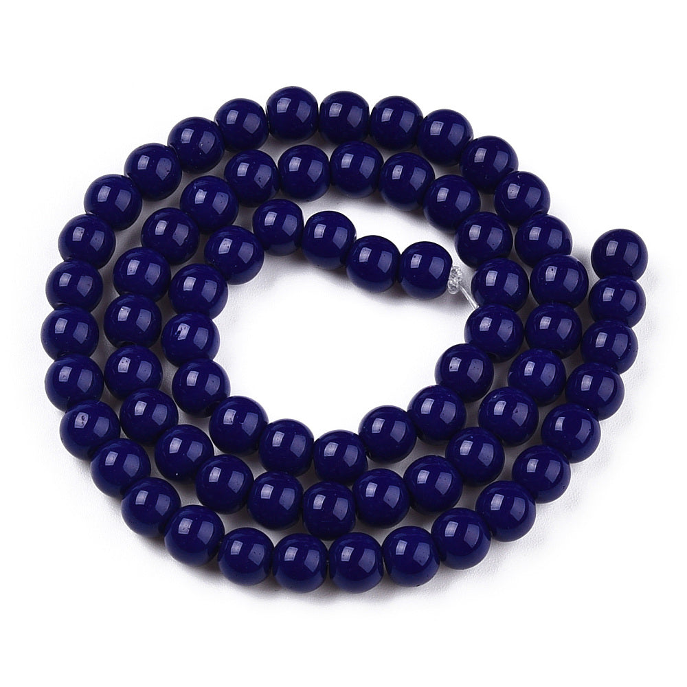 Navy blue beaded necklace on a white background