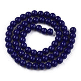 Navy blue beaded necklace on a white background