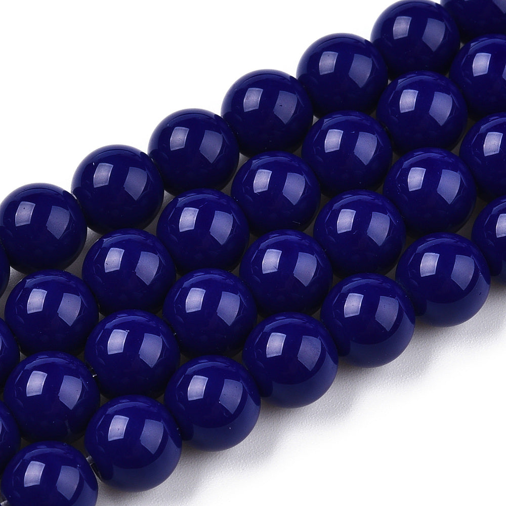 Close-up of dark blue beads on a white background