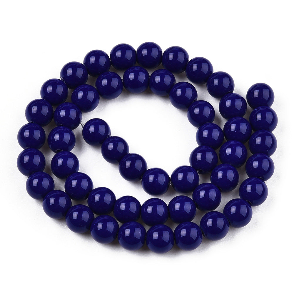 Navy blue beads on a white background