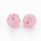 Two faceted pink glass beads with a single central hole, displayed on a clean white background.