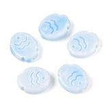 Five light blue fish ceramic beads with wave design on a white background