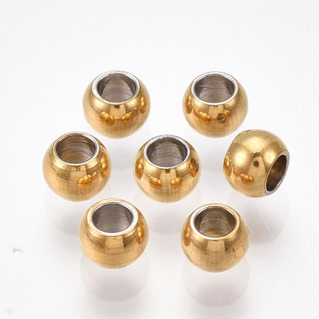 anti tarnish gold surface on gold beads shown on a white background
