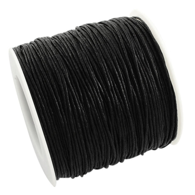 Spool of black cord on a white background