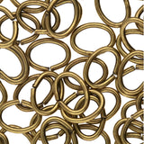 Collection of bronze metal rings on a white background
