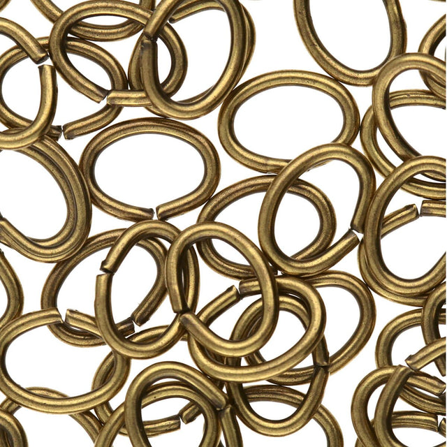 Collection of bronze metal rings on a white background