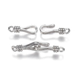Two silver metal clasps on a white background