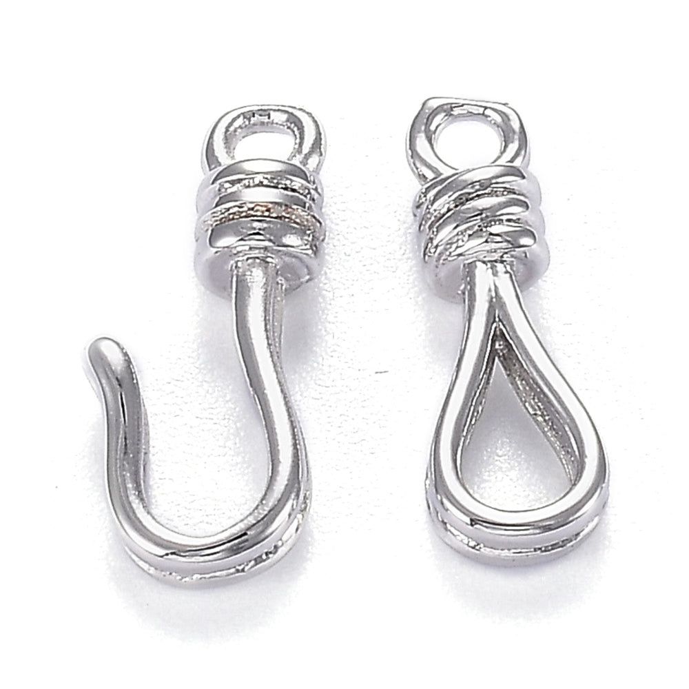 Two silver jewelry clasps on a white background