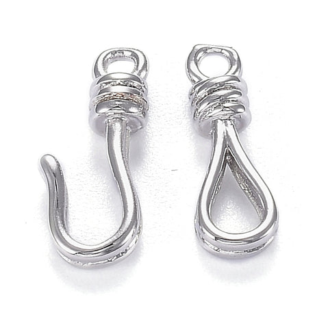 Two silver jewelry clasps on a white background