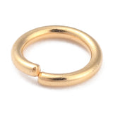 Gold jump ring on a white background