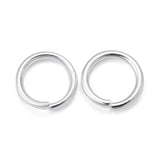 Two silver  connector rings on a white background
