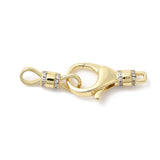 Gold clasp with diamond accents on a white background
