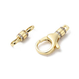 Gold jewelry clasp with diamond accents on a white background
