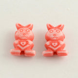 2 Colorful rabbit-shaped beads on a white background