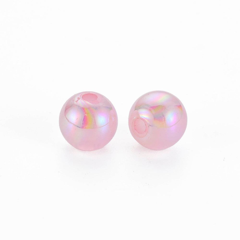 Two pink pearls on a white background