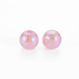 Two pink pearls on a white background