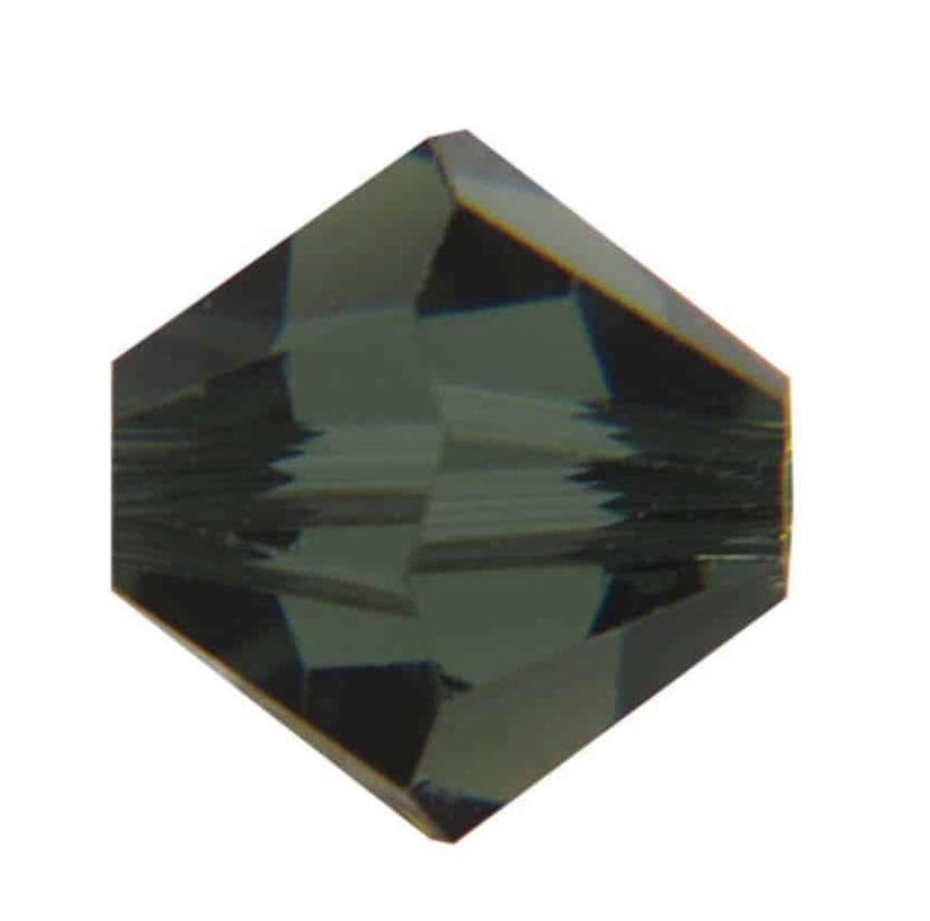 One green faceted crystal bead on a white background