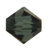 One green faceted crystal bead on a white background