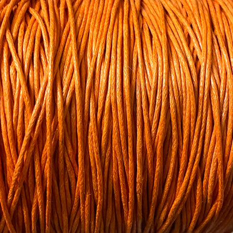Close-up of orange wax cotton strands