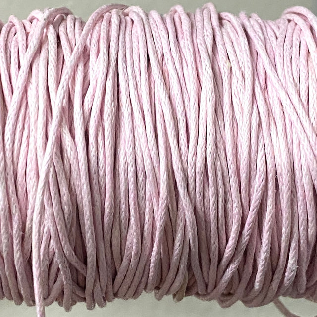 Close-up of light pink wax cotton strands