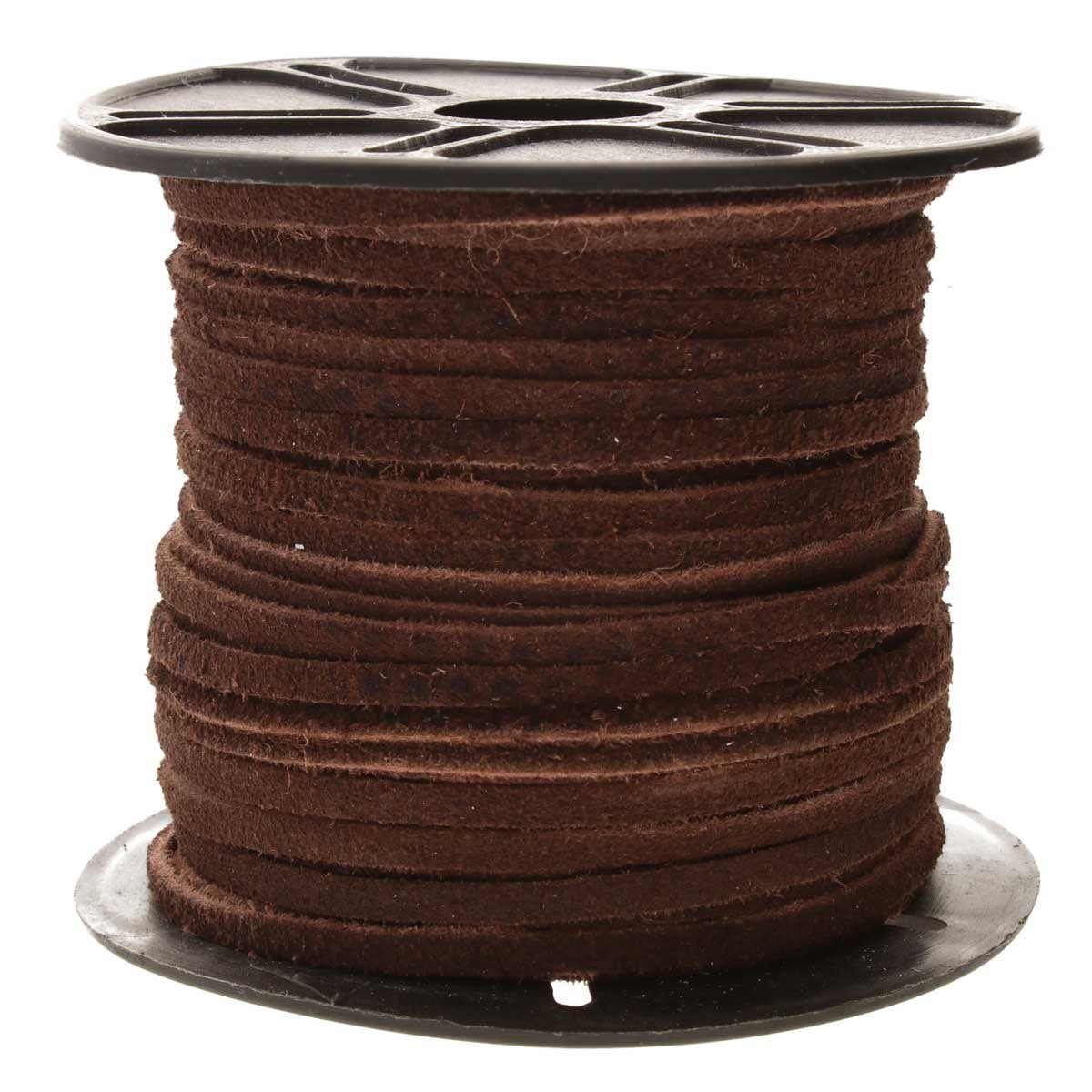 Spool of brown cord on a white background