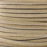 Close-up of beige leather cord with visible texture