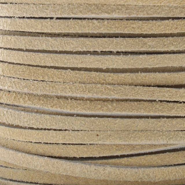 Close-up of beige leather cord with visible texture
