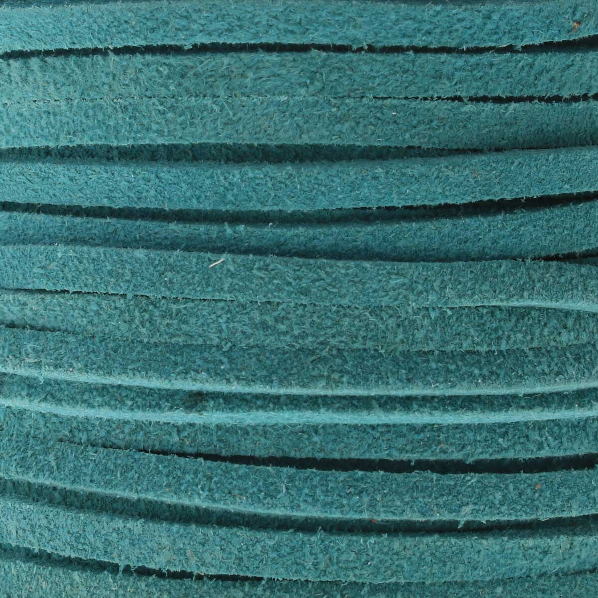 Close-up of teal-colored suede leather lace with textured surface