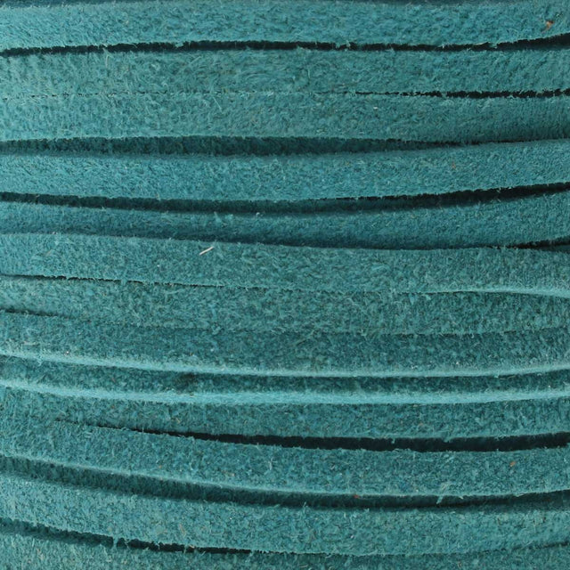Close-up of teal-colored suede leather lace with textured surface