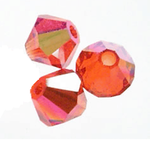 Three orange faceted crystal beads on a white background