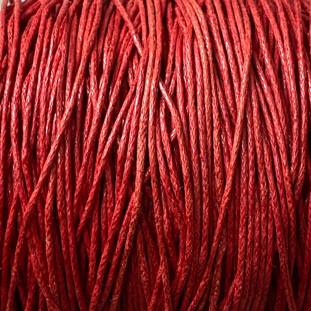 Close-up of red wax cotton strands
