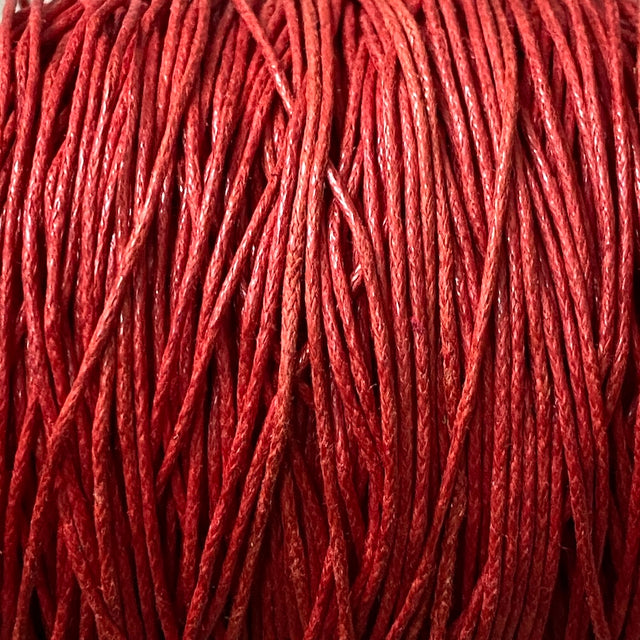Close-up of red wax cotton strands
