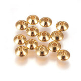 Gold beads on a white background