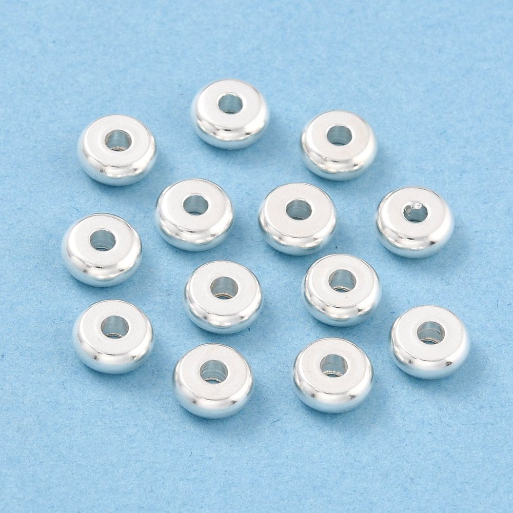 Silver beads on a blue background
