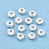 Silver beads on a blue background