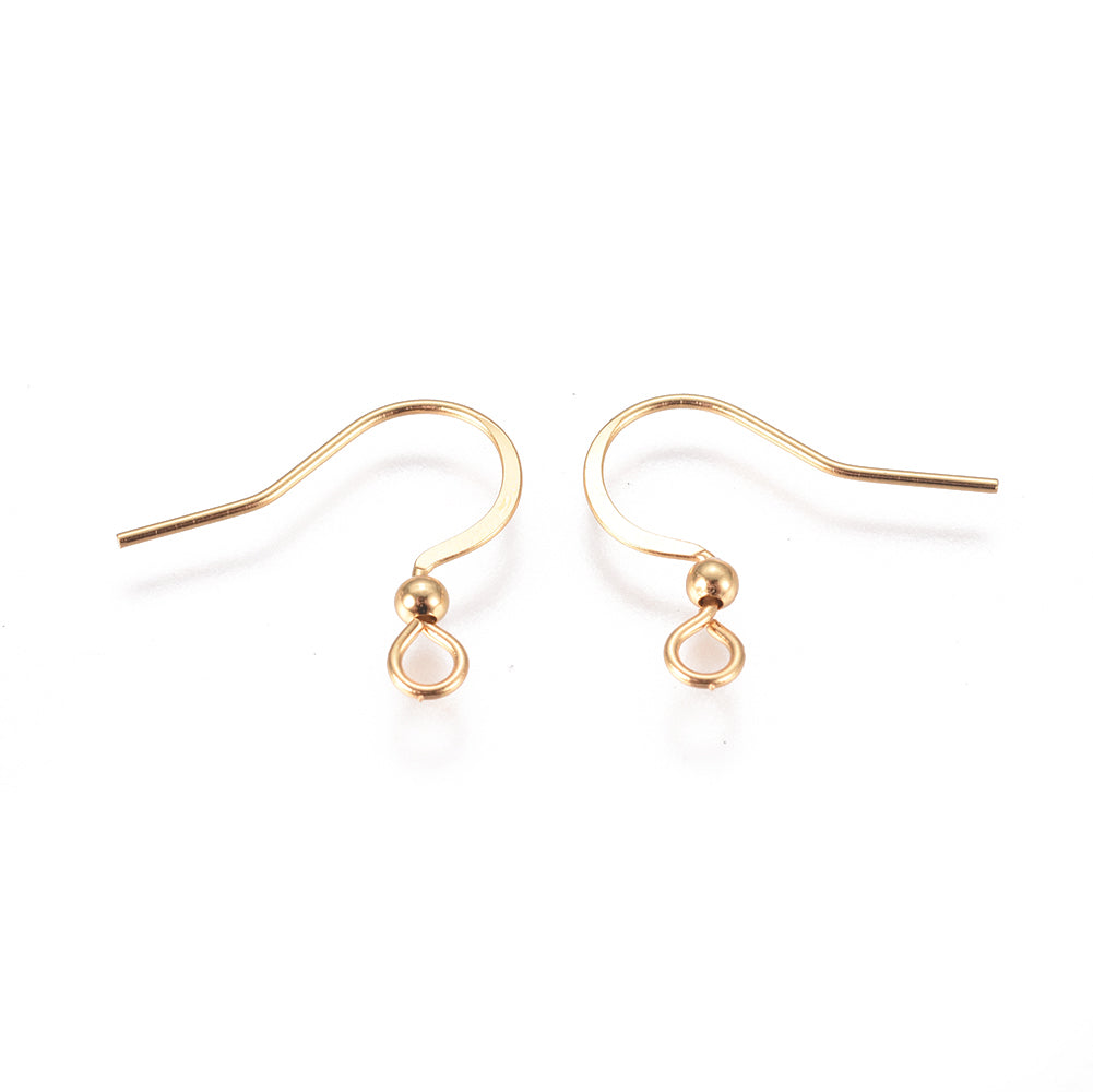 close up of a collection of gold anti tarnish ear wires with a white background 