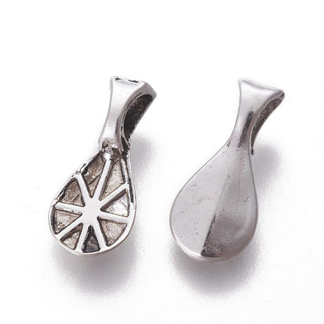 tibetan look metal oval bails with patterning for the glue to hold on a white background