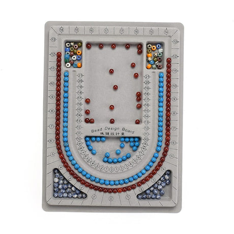 Bead design board with colorful beads arranged in a decorative pattern on a white background.