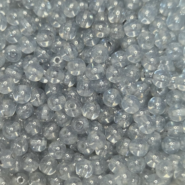 Close-up of very light blue glass beads