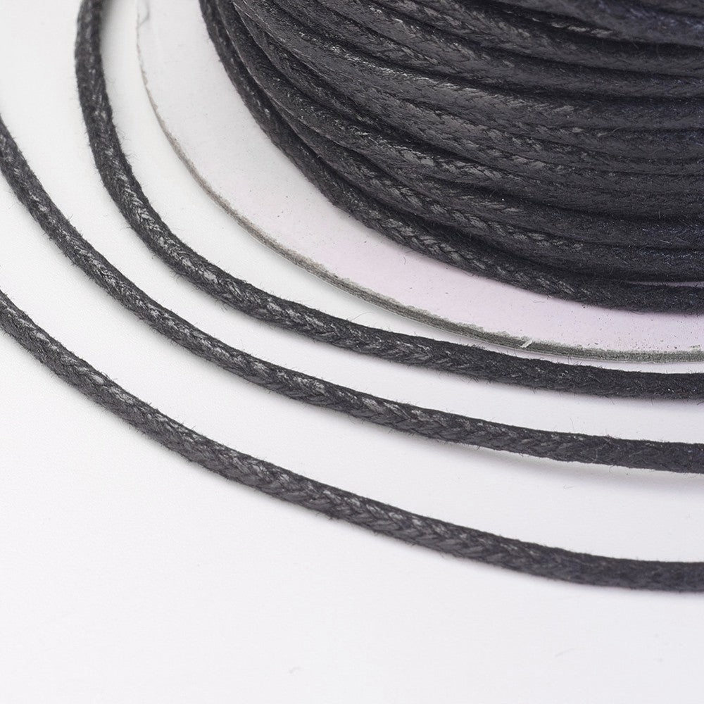 Close-up of black cord on a white background
