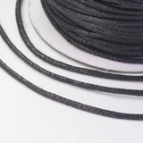 Close-up of black cord on a white background