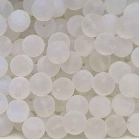 Close-up of white spherical beads on a white background