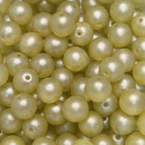 Close-up of pale yellow pearls with a soft focus