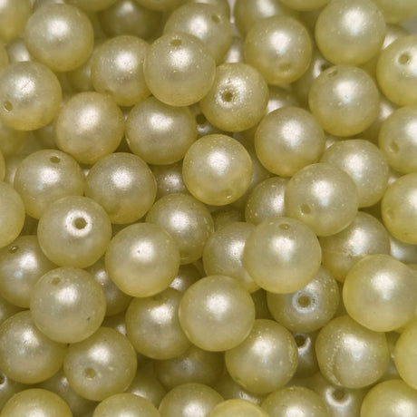 Close-up of pale yellow pearls with a soft focus