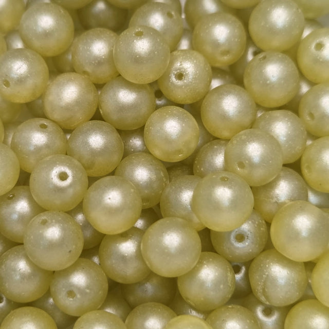 Close-up of pale yellow pearls with a soft focus