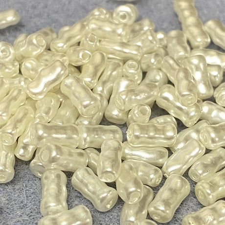 pearl plastic beads on a gray surface