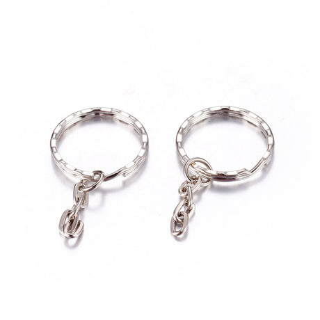 Two silver keychains with small chains on a white background